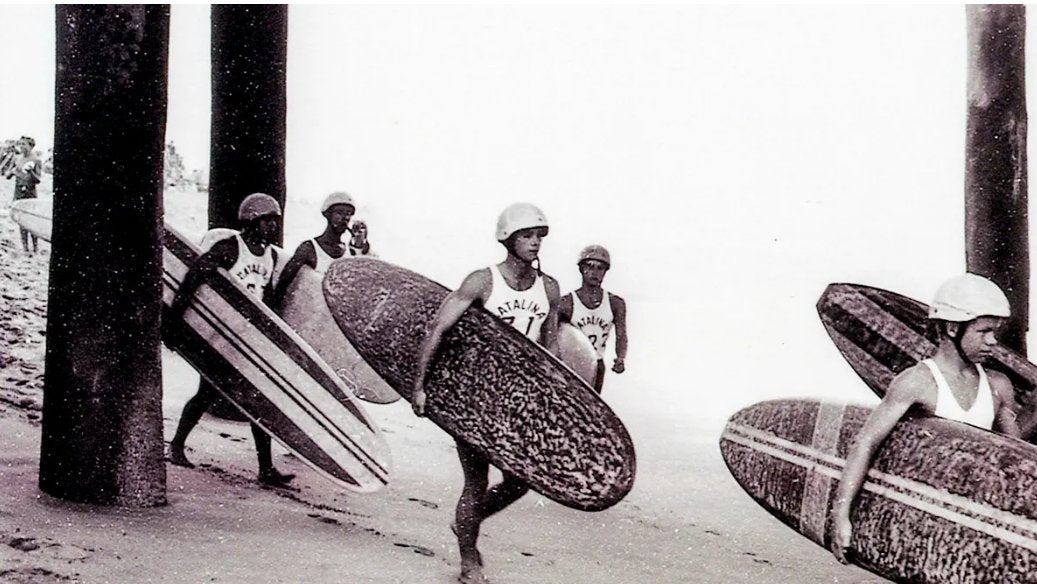 In what year did the first official surf contest take place? - Kaspian